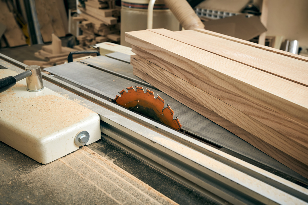 Circular Electric Saw and Finished Boards in a Carpenter's Workshop.